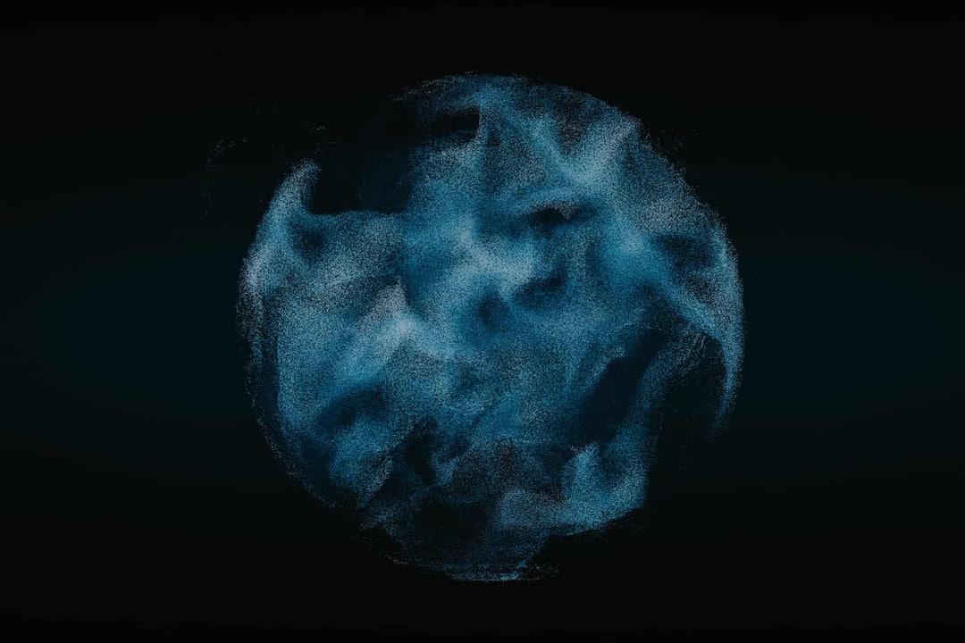 Image of a swirling sphere-like shape made up of individual blue particles
